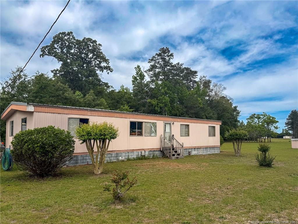 Exterior photo of 1308 Mac D Road, Orrum, NC 28369. MLS: 762609