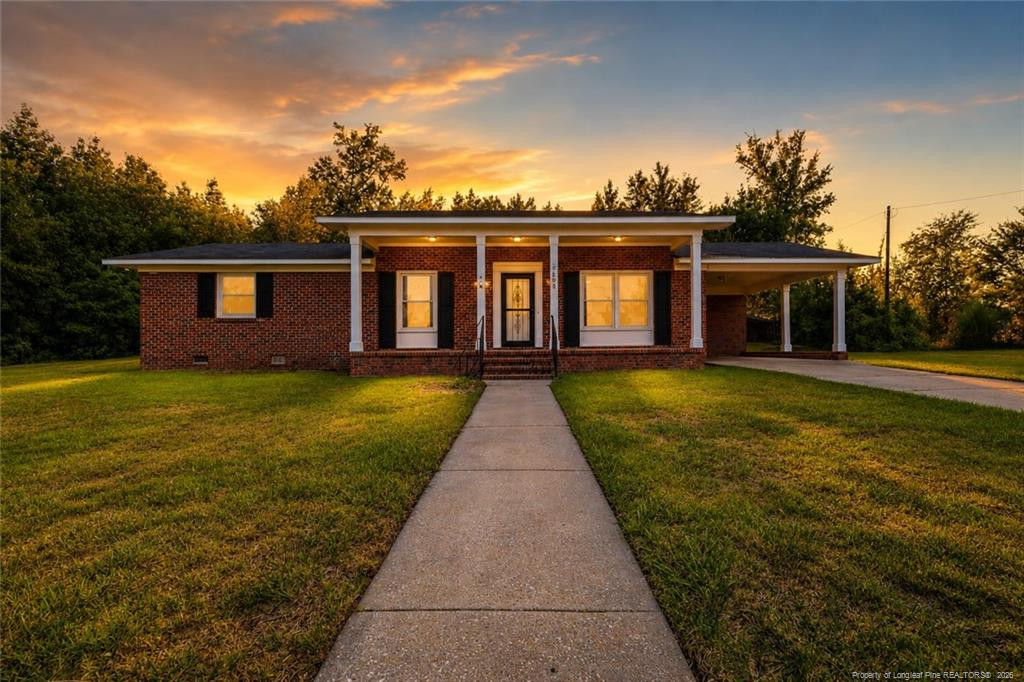 Exterior photo of 7401 Paxton Drive, Fayetteville, NC 28303. MLS: 768650