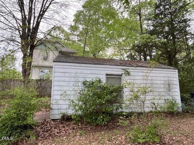 The side of the Shed with Neighbor Backy