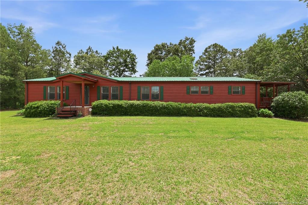 Exterior photo of 10400 Ruth Vinson Road, Autryville, NC 28318. MLS: 762548