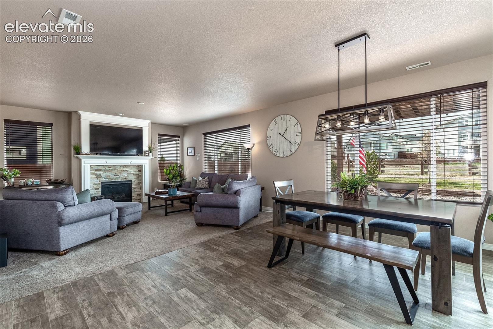 The great room is perfect for entertaining or relaxing with family by the cozy gas fireplace