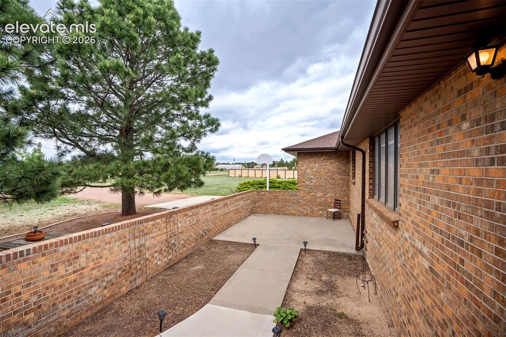 Front enclosed courtyard perfect for gardening, gatherings to enjoy mountain views/Pikes Peak