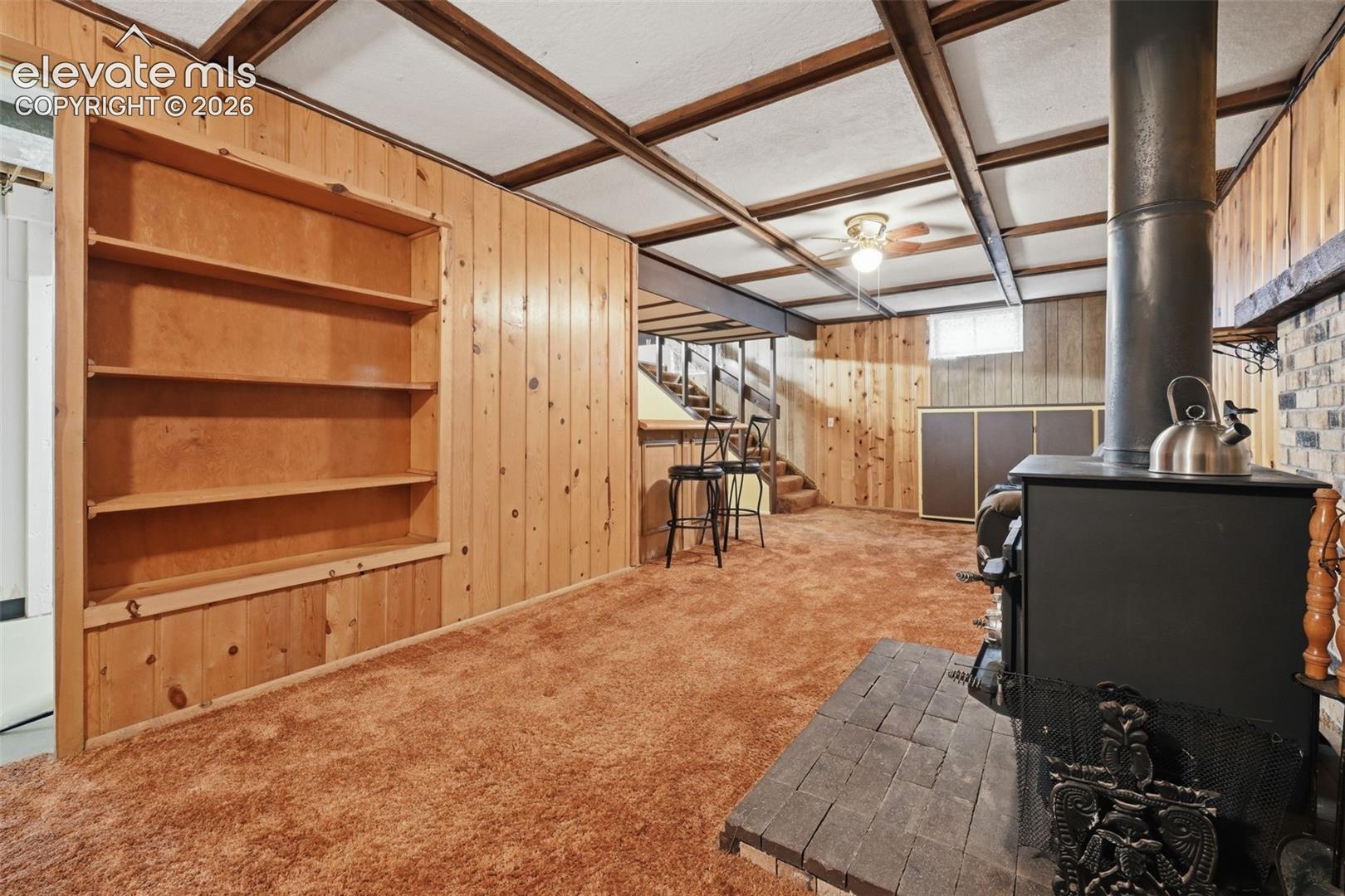 Basement Family Room with Woodburning Stove and Built-ins