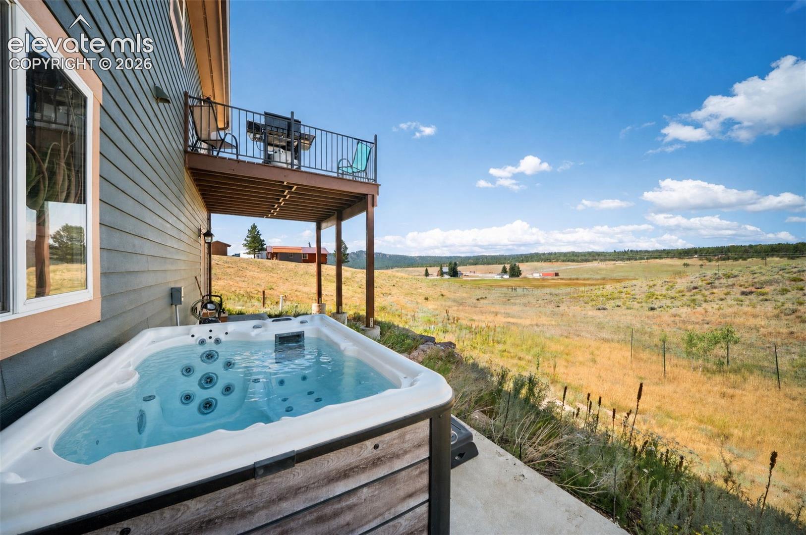 Hot tub with breathtaking mountain and valley views.