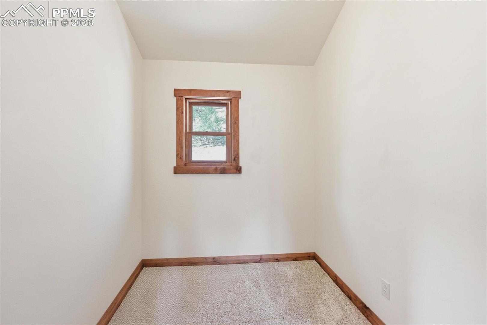 Primary bedroom hosts an office space. This room could also serve as a reading a library, hobby corner, or dressing room.