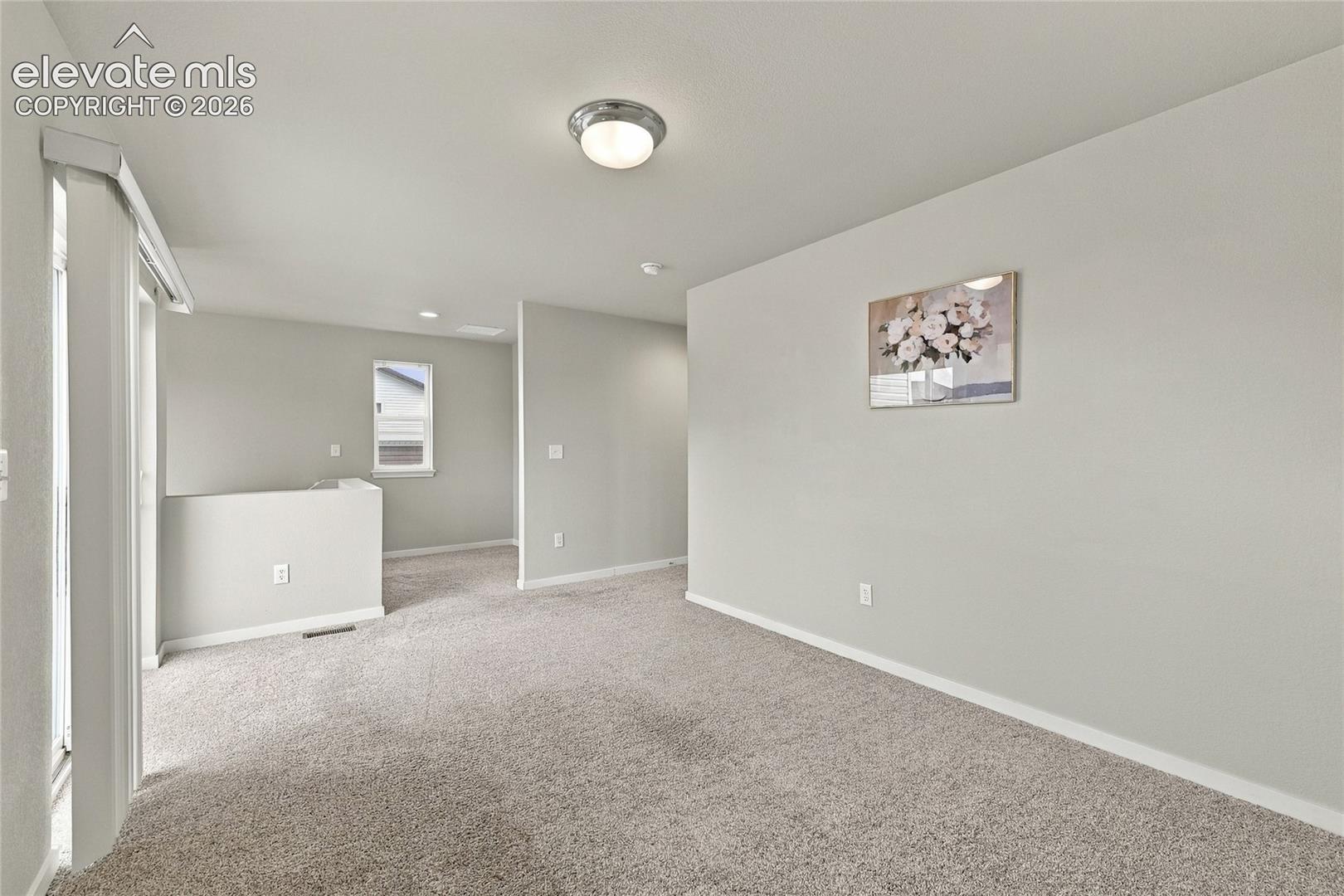 Light gray painted walls with recessed lighting