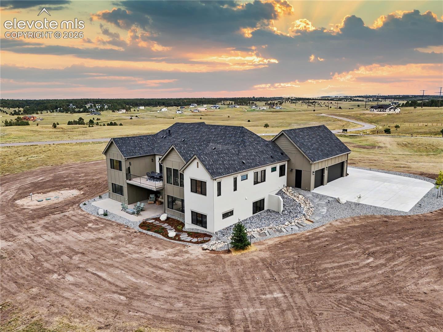 Side view, showcasing the architectural elements of the home!