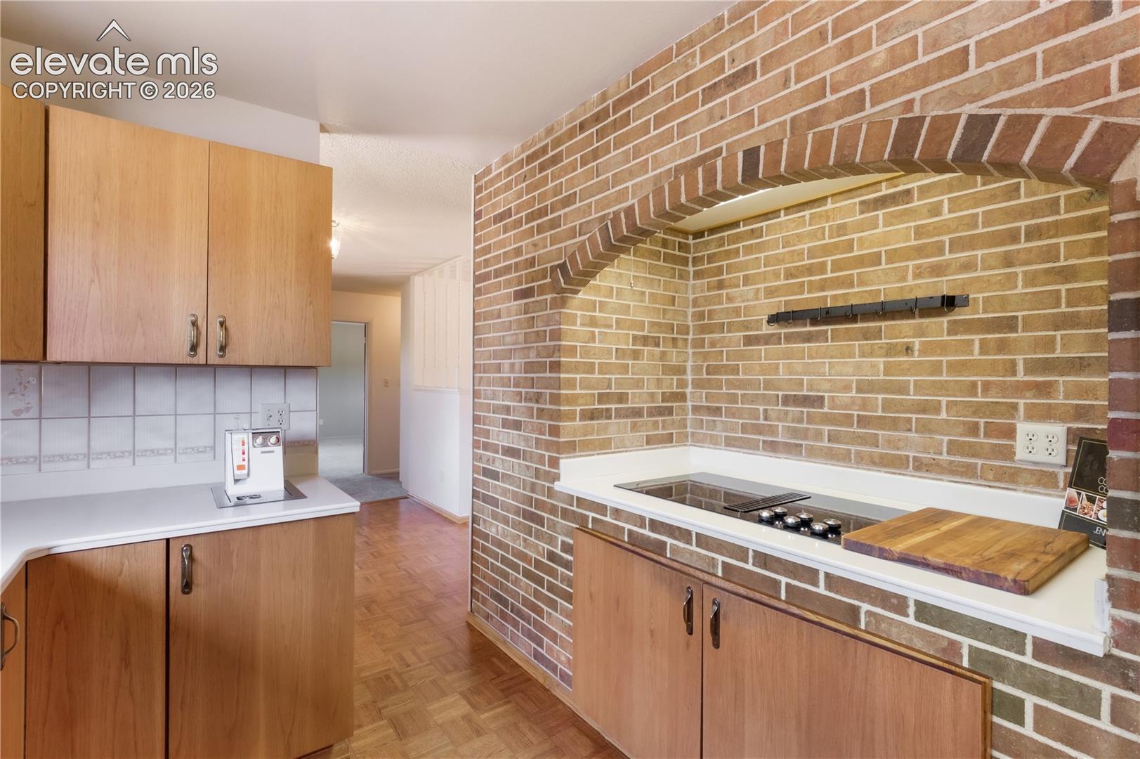 Kitchen with charm, ronson Foodmatic up and brick archway over cooktop