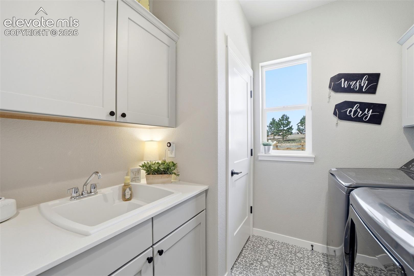 Also added a utility sink & storage cabinets with a closet. 