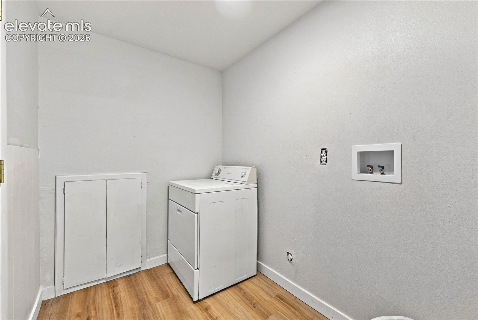Wood-finish flooring with white wall finishes