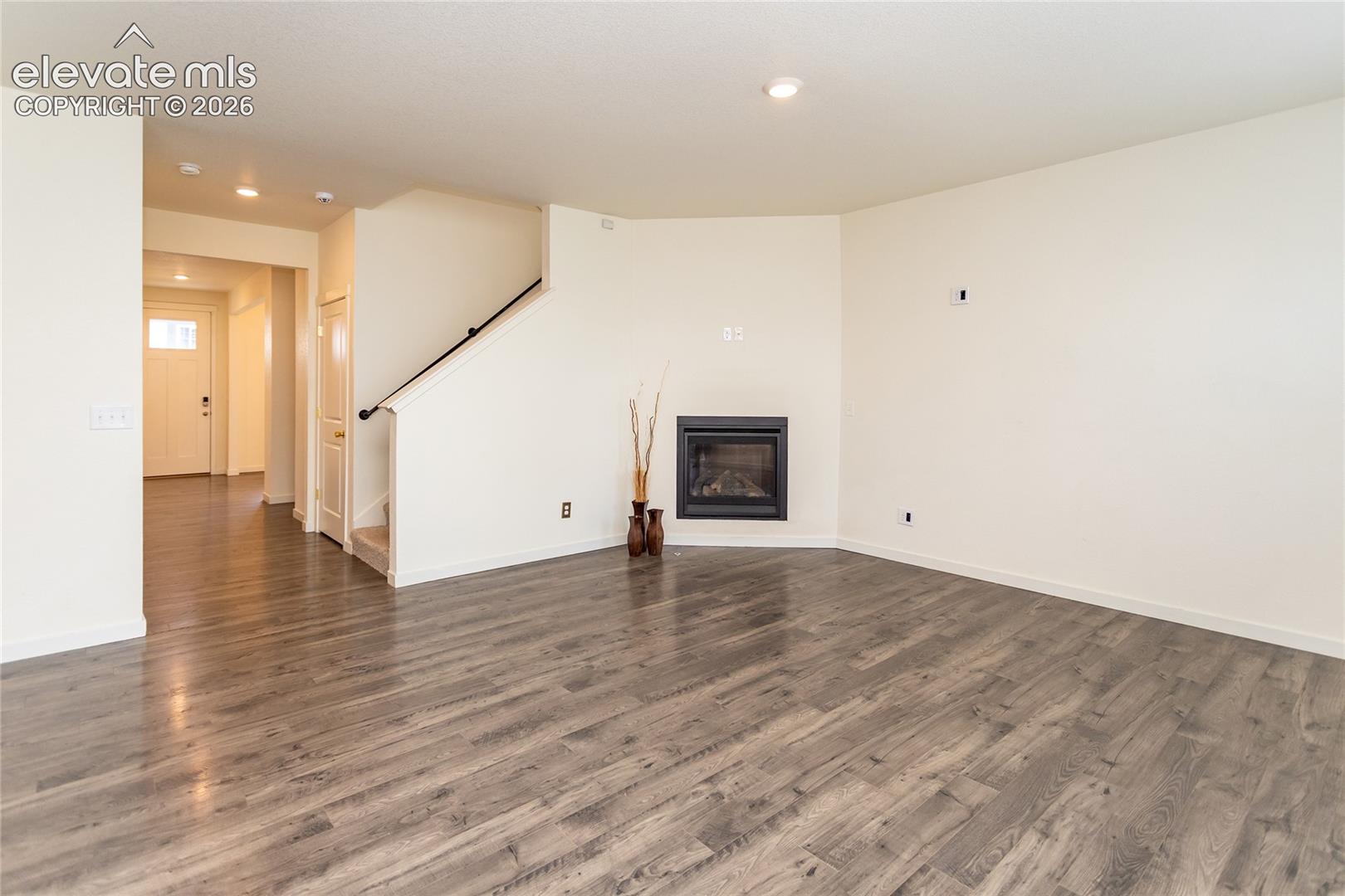 Another view of the living room and the entry hallway.
