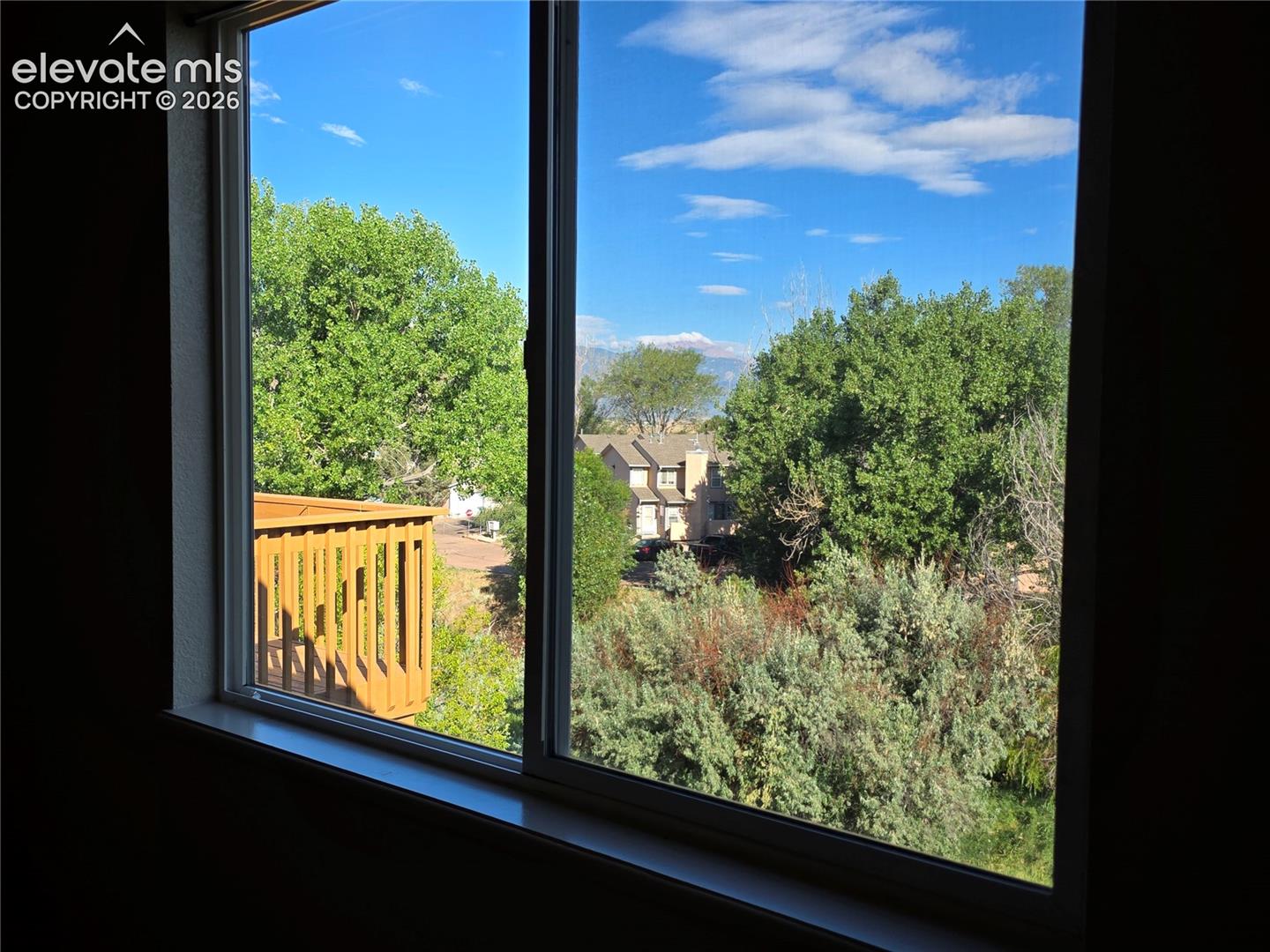 Seller provided photo of view of Pikes Peak from primary bedroom