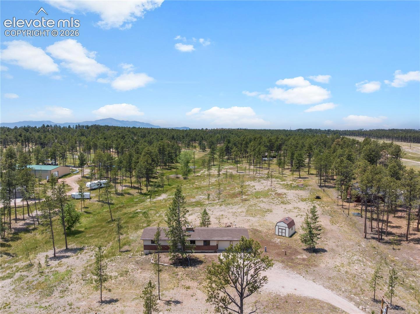 Aerial view of the house and 5 acres looking west