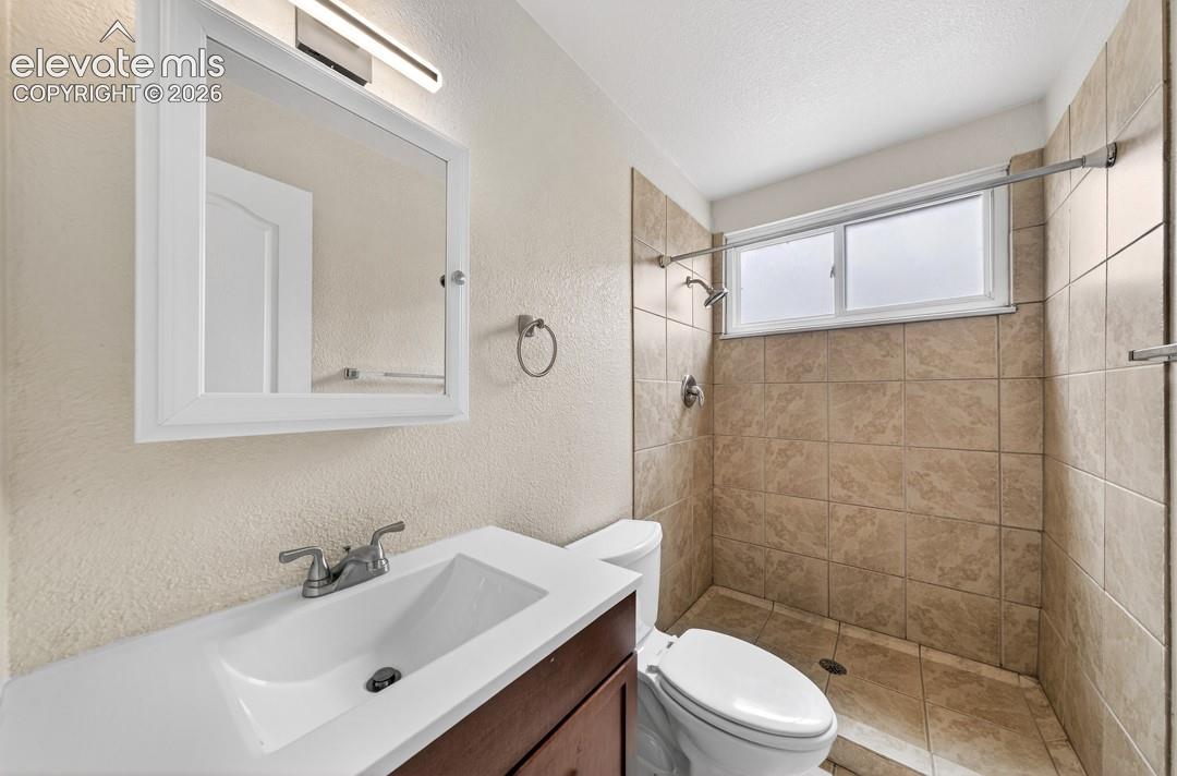 Vanity with integrated sink and chrome faucet