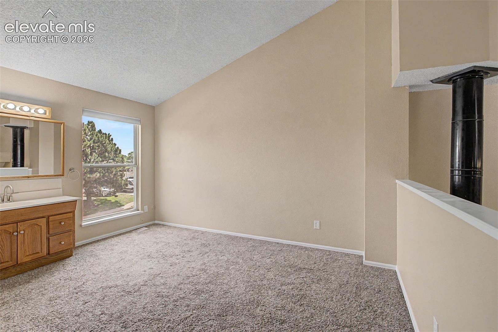 The naturally lit bedroom has its own full bathroom!