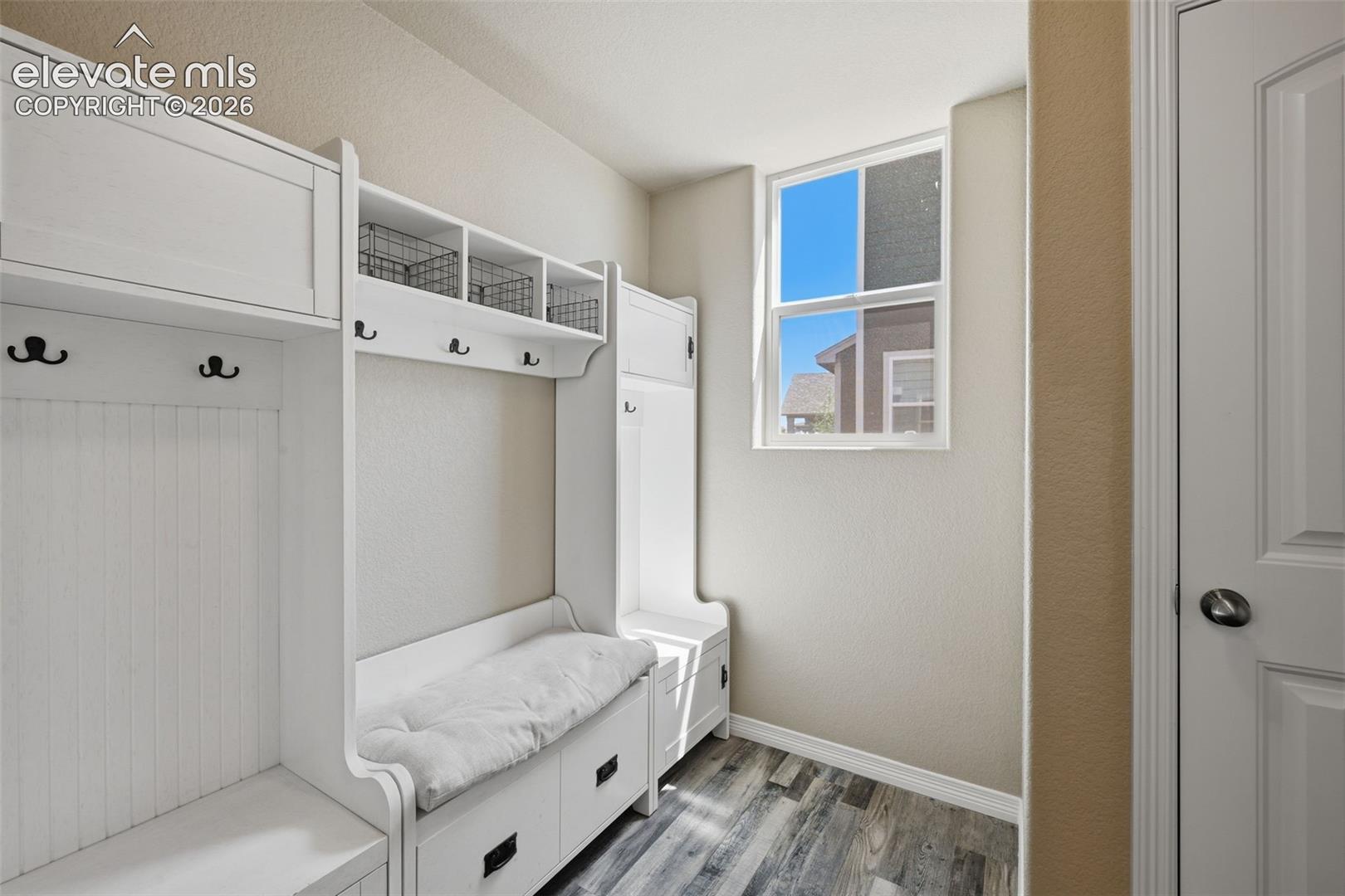 Functional Mudroom Provides a Convenient Drop Zone Just Inside the Garage Entry