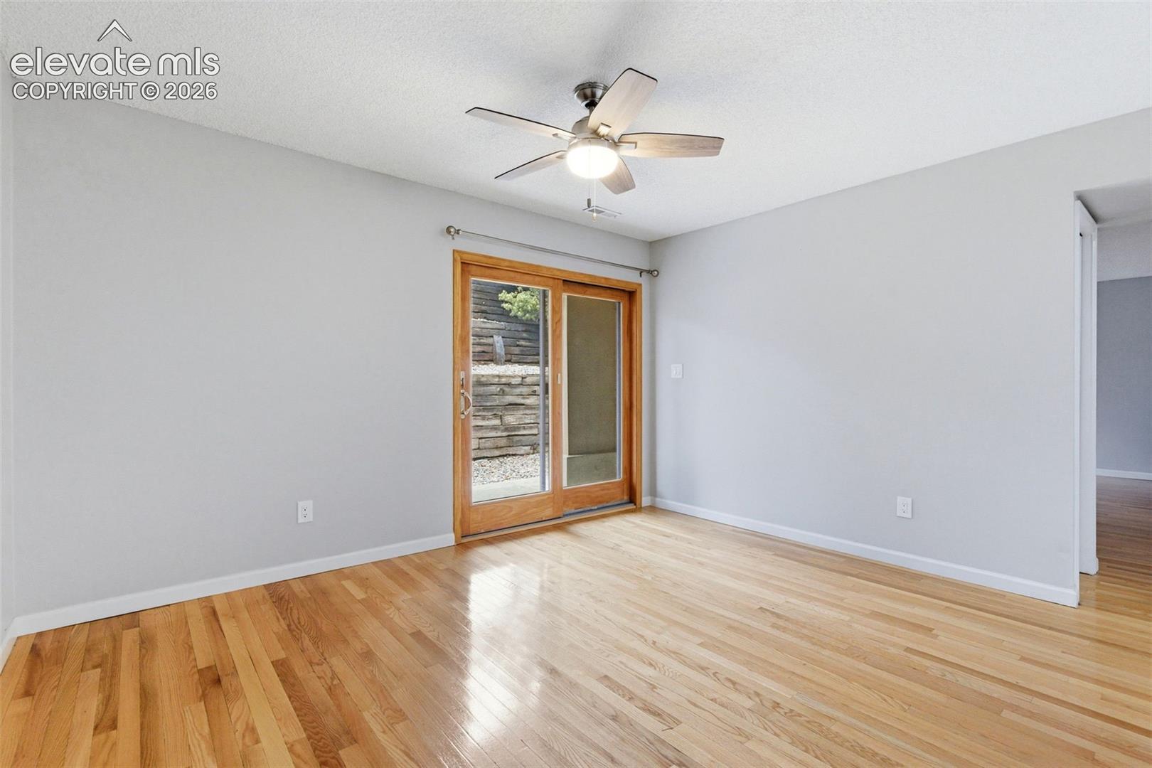 Light wood-finish flooring with a neutral wall color