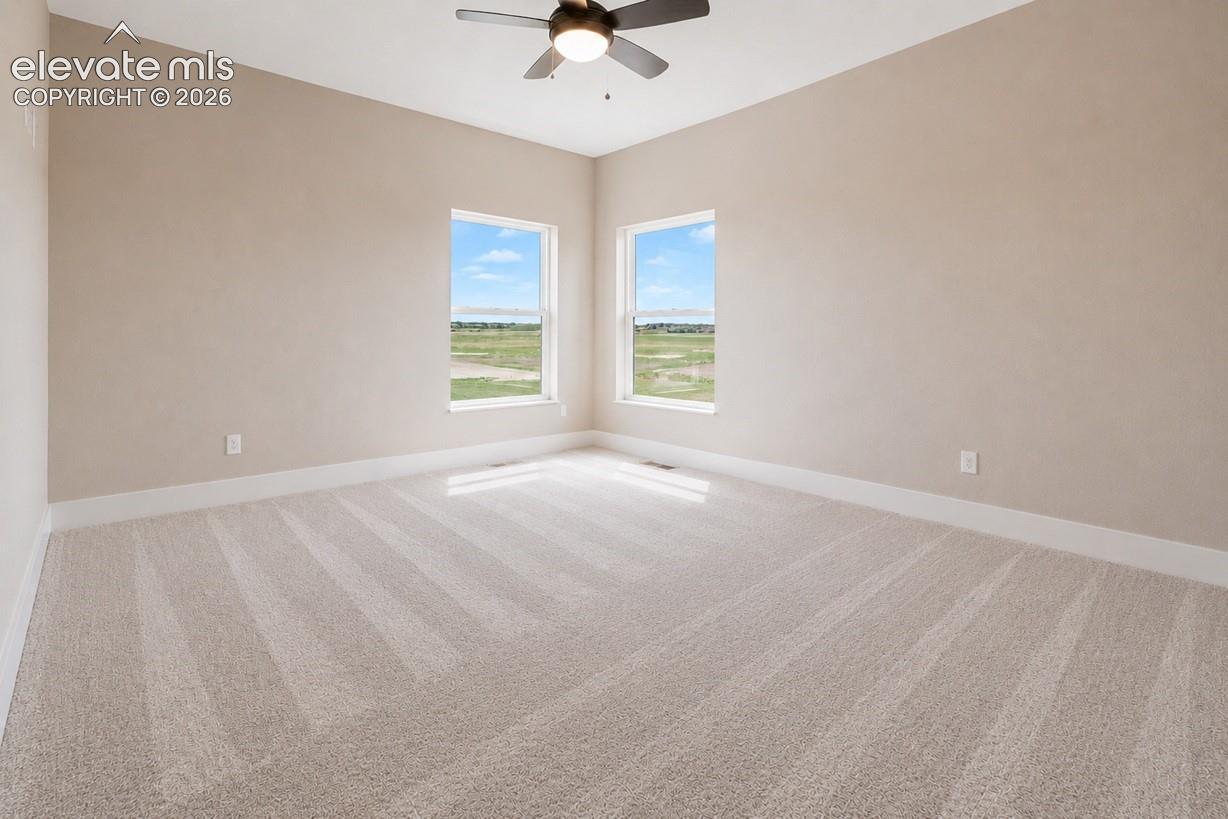 Spacious room with plush light-toned carpeting and neutral wall tones