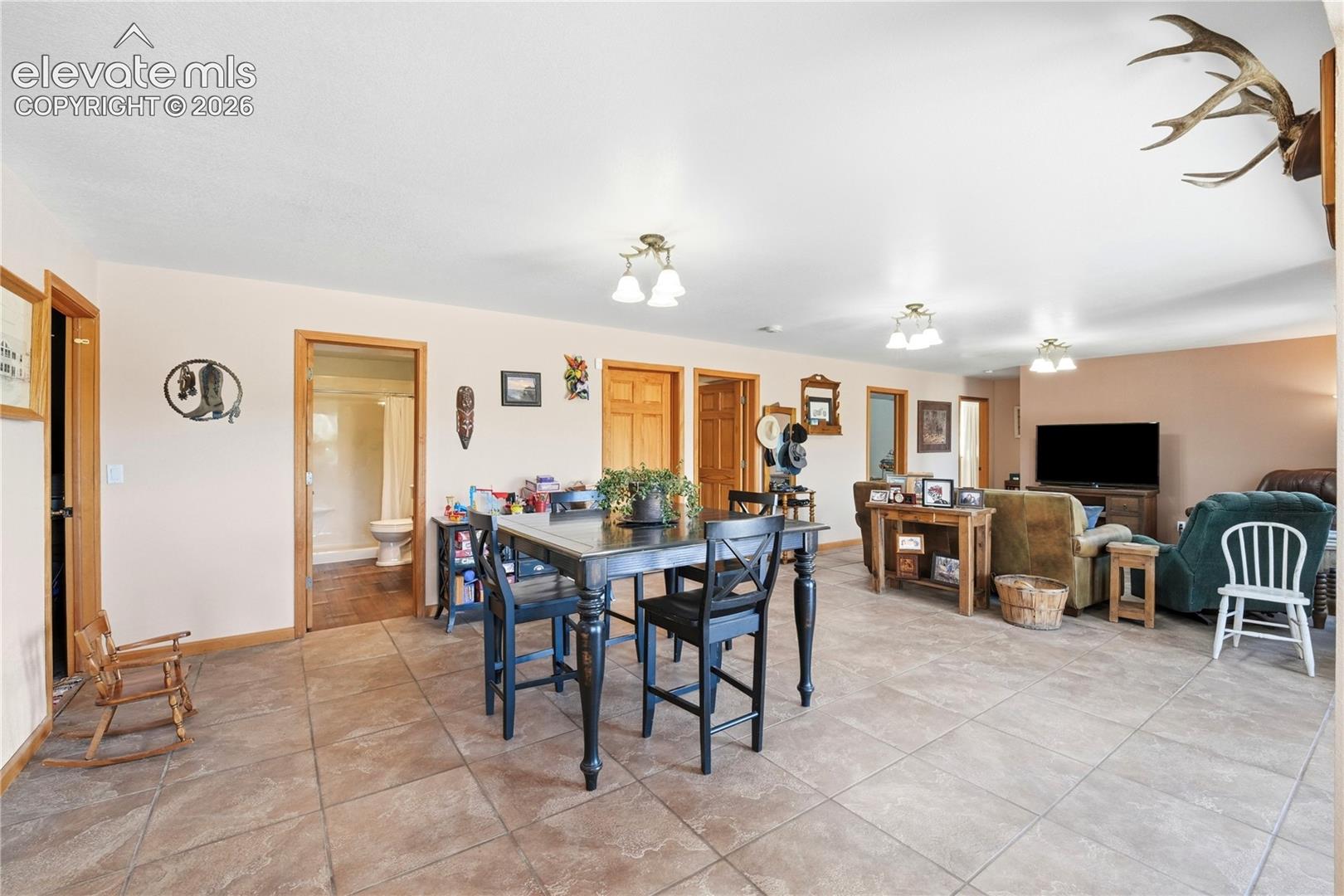 Ceramic tile flooring extends through the dining area and into the entryway