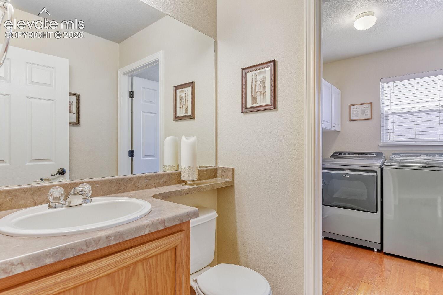 Main level half  bath with laundry.