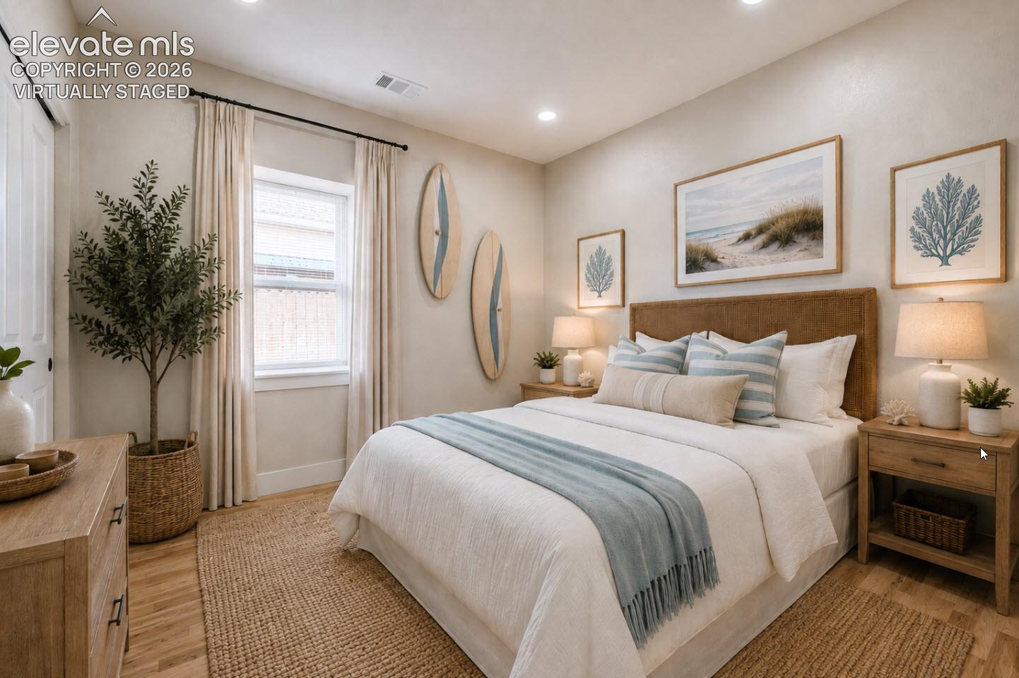 This beautiful second bedroom is virtually staged as a guest room.