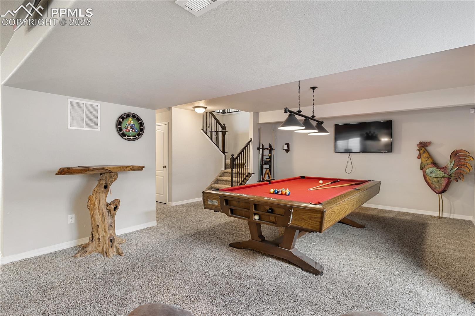 Large basement rec room with versatile living space.