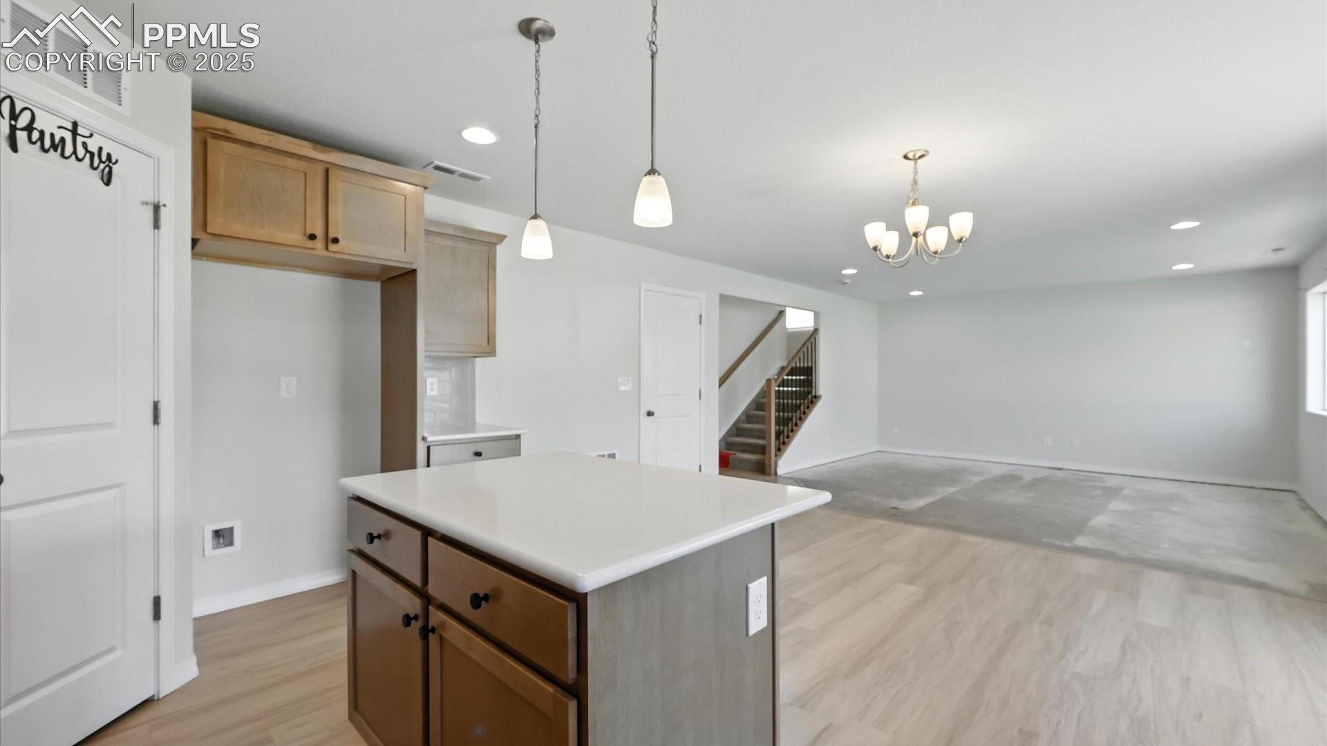 View of the Kitchen, Dining Area, and Living Room.