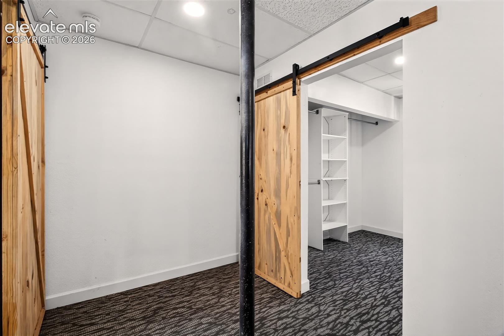 Landing at base of stairs, bedrooms on either side.