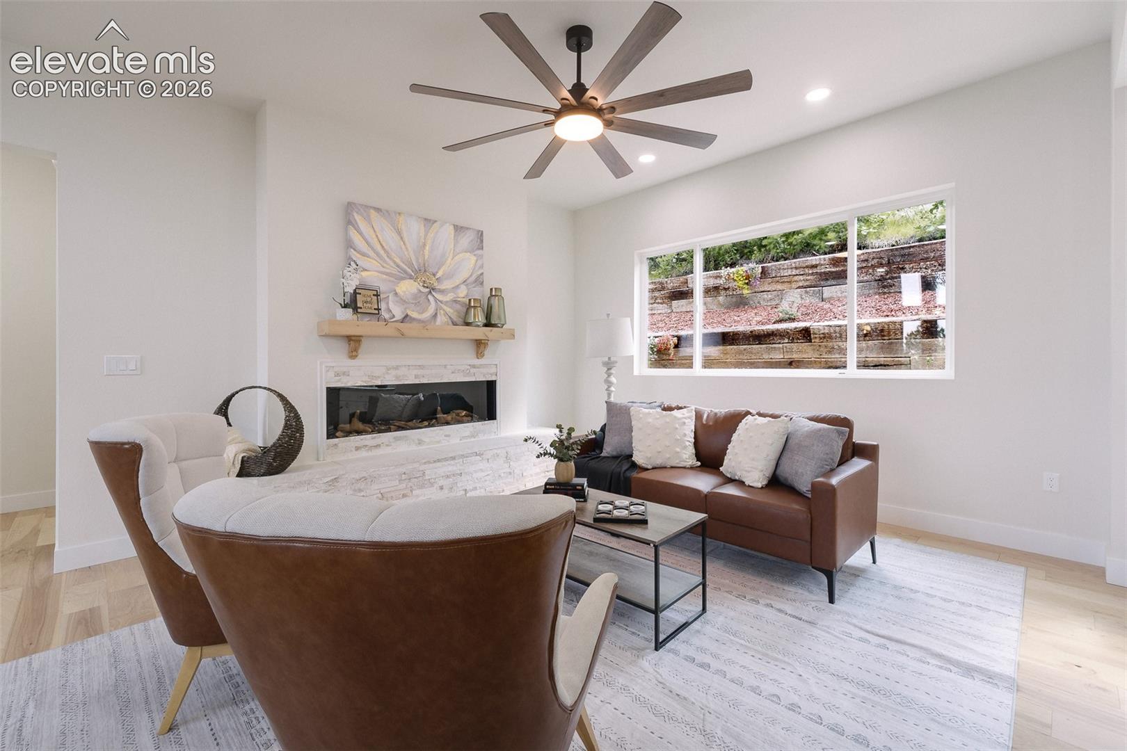 The Great Room offers a lighted ceiling fan and electric fireplace for chilly winter evenings.