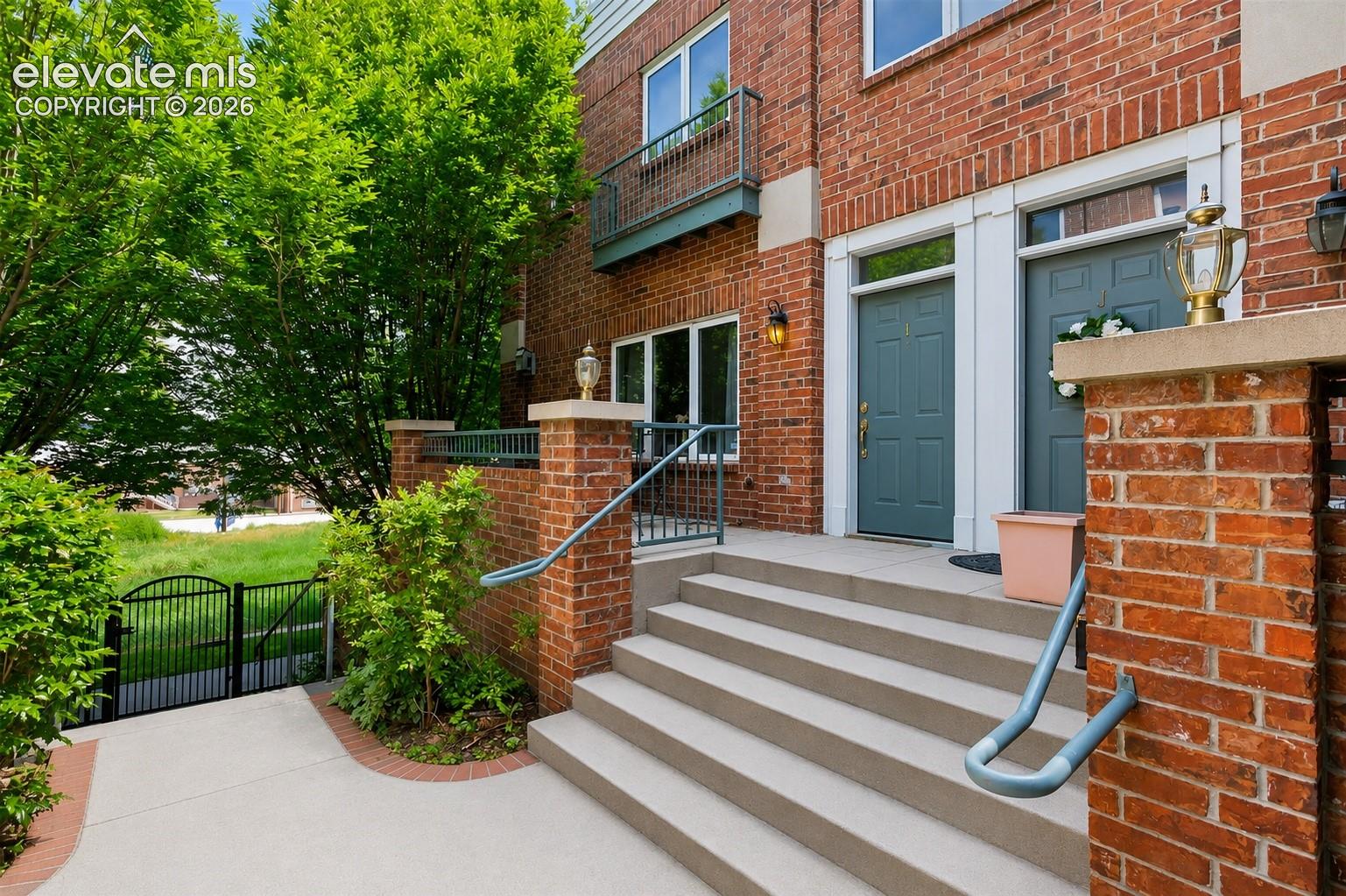 Updated end-unit brick townhome just steps from the University of Denver, tucked on a quiet, tree-lined street. This spacious 4-bedroom, 3-bath home combines modern upgrades with comfort and convenience. Fresh interior paint and newly refinished hardwood floors create a warm, inviting feel, while large north-facing windows bring in abundant natural light and offer views of Harvard Gulch Park. The main level features a welcoming living room with a cozy gas fireplace, a formal dining area, and a well-appointed kitchen with newer stainless steel appliances, center island, and generous cabinetry.A versatile main-floor bedroom with a full bath and large closet can easily function as a primary suite, guest room, office, or additional living space.Upstairs, you’ll find two spacious en-suite bedrooms, including an oversized primary retreat with room for multiple beds and a sitting area, plus a spa-inspired bath with jetted tub. A large laundry room with washer and dryer adds convenience on this level.The garden-level bedroom or flex space includes a roughed-in bath, offering excellent potential for future expansion. Enjoy an oversized two-car garage with private entry and built-in storage. Recent upgrades include a newer HVAC system and water heater. Ideally located near parks, dining, shopping, public transit, and major amenities, including Washington Park, Cherry Creek Shopping Center, and Porter Adventist Hospital.  An excellent opportunity to enjoy urban living with a peaceful neighborhood feel.
