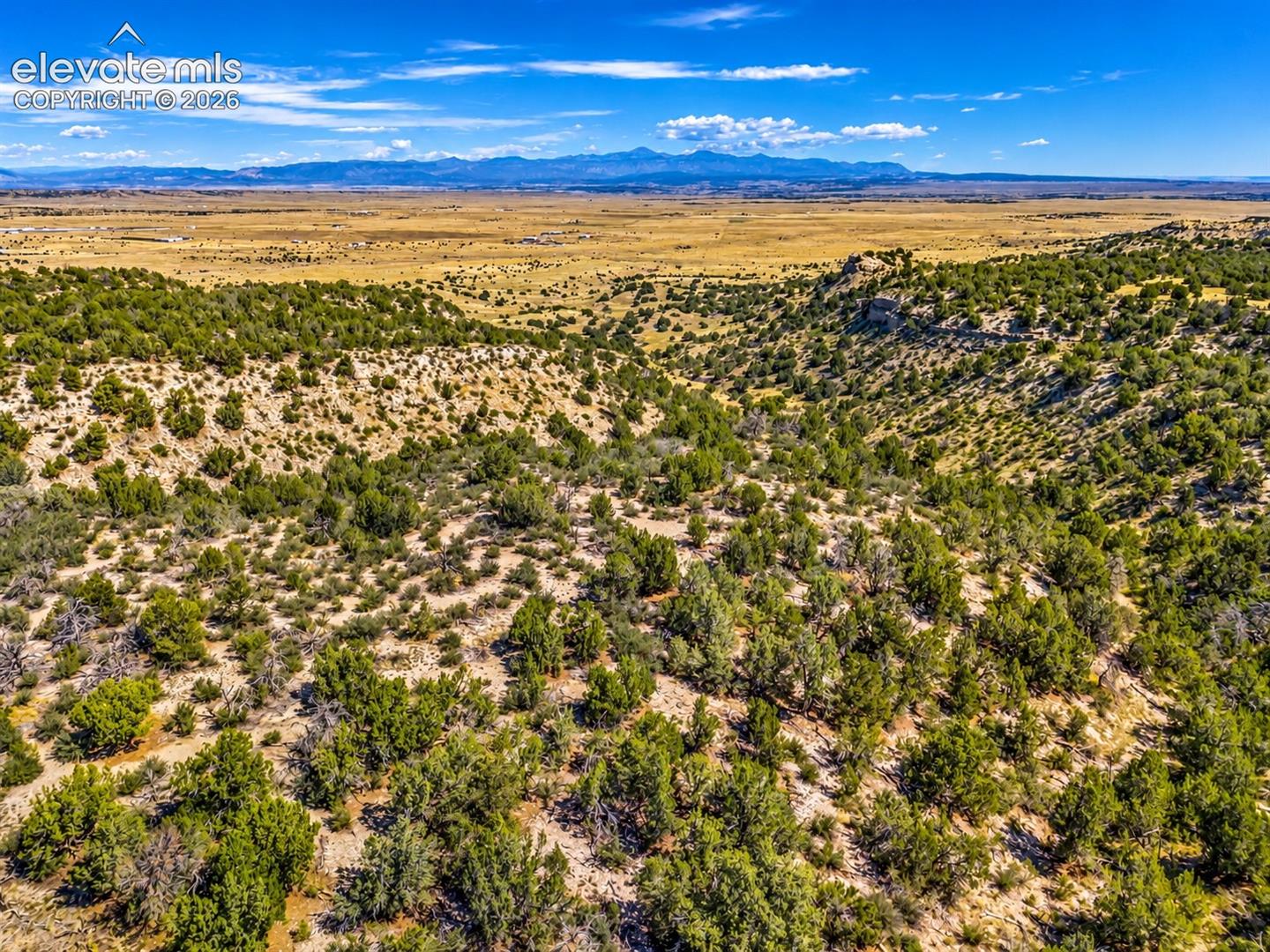 Sweeping panoramic views of the surrounding valleys, distant mountain ranges, and rolling countryside. Experience the beauty and tranquility of Southern Colorado's rural landscape.

