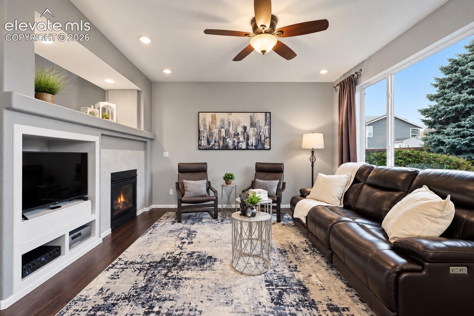 Large windows fill the family room with natural light while the second fireplace elevates this inviting gathering space.