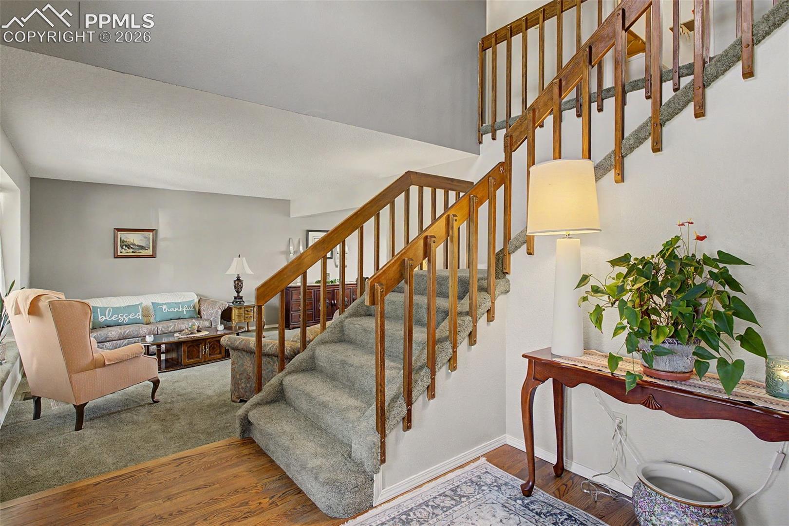 Entrance foyer- walk through the front door to the stairs in front of you, formal living and dining rooms on the left, and hallway to family room and powder room on the right.
