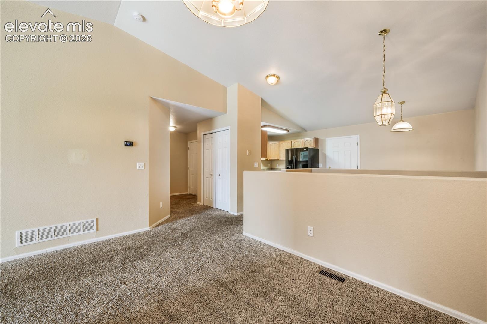 Dining area between kitchen eat in area and living room