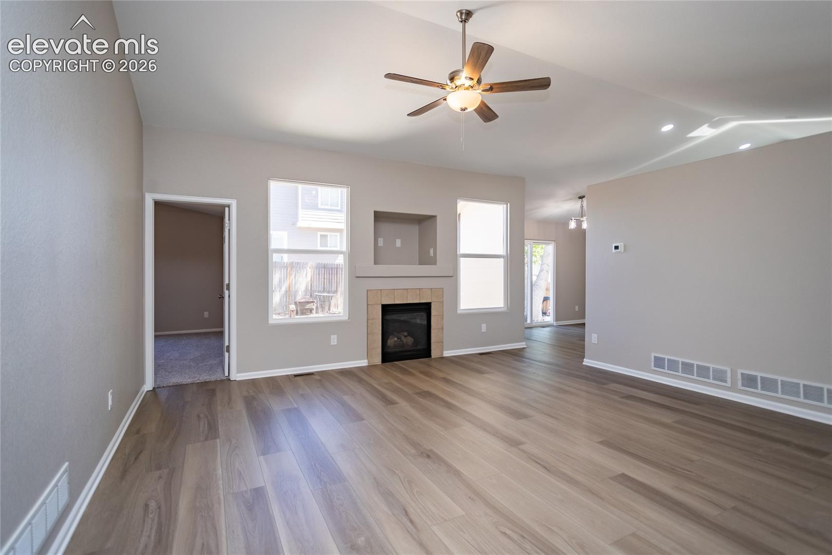 Neutral LVP, vaulted ceilings, ceiling fan, lots of light, gas fireplace!