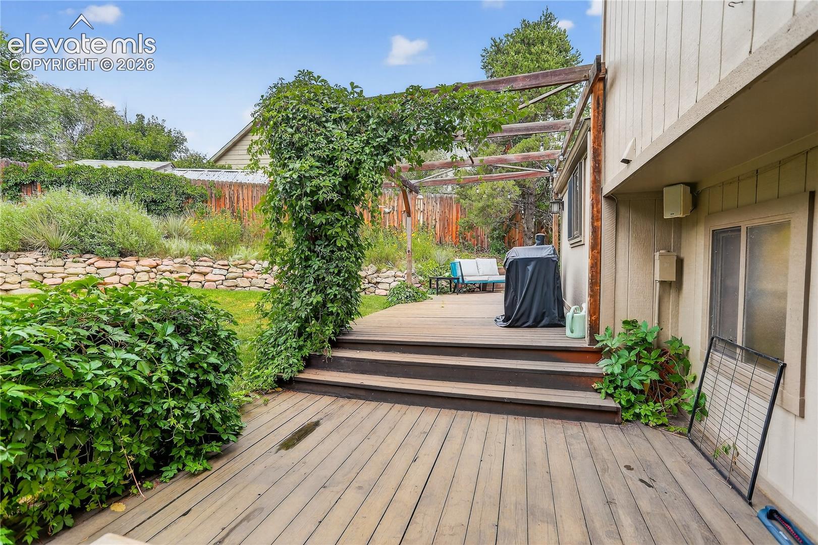 Wood deck w/ walk-outs from dining & family rooms
