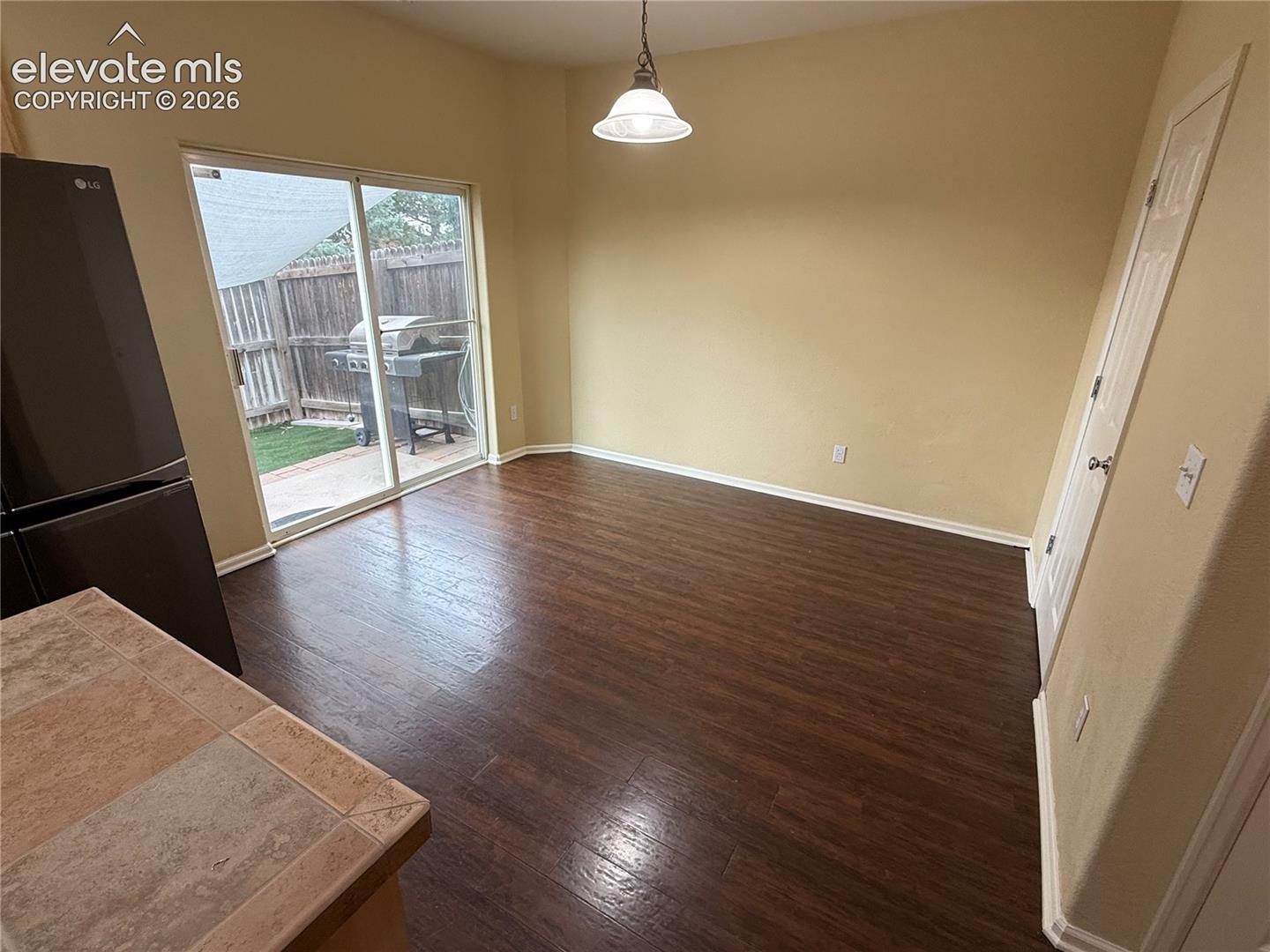 Dining area with wood-finish flooring