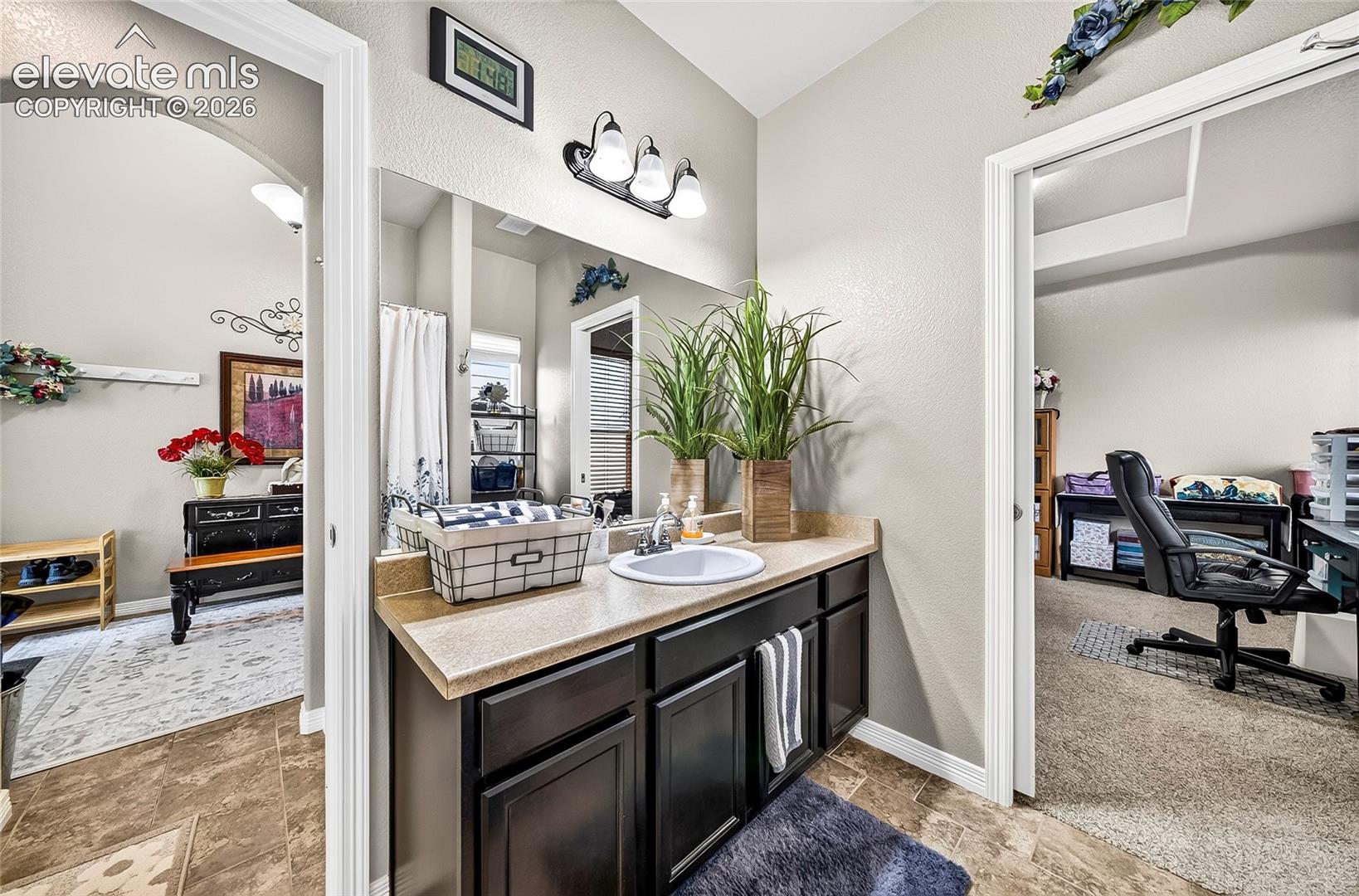 Sink view of full bathroom main level