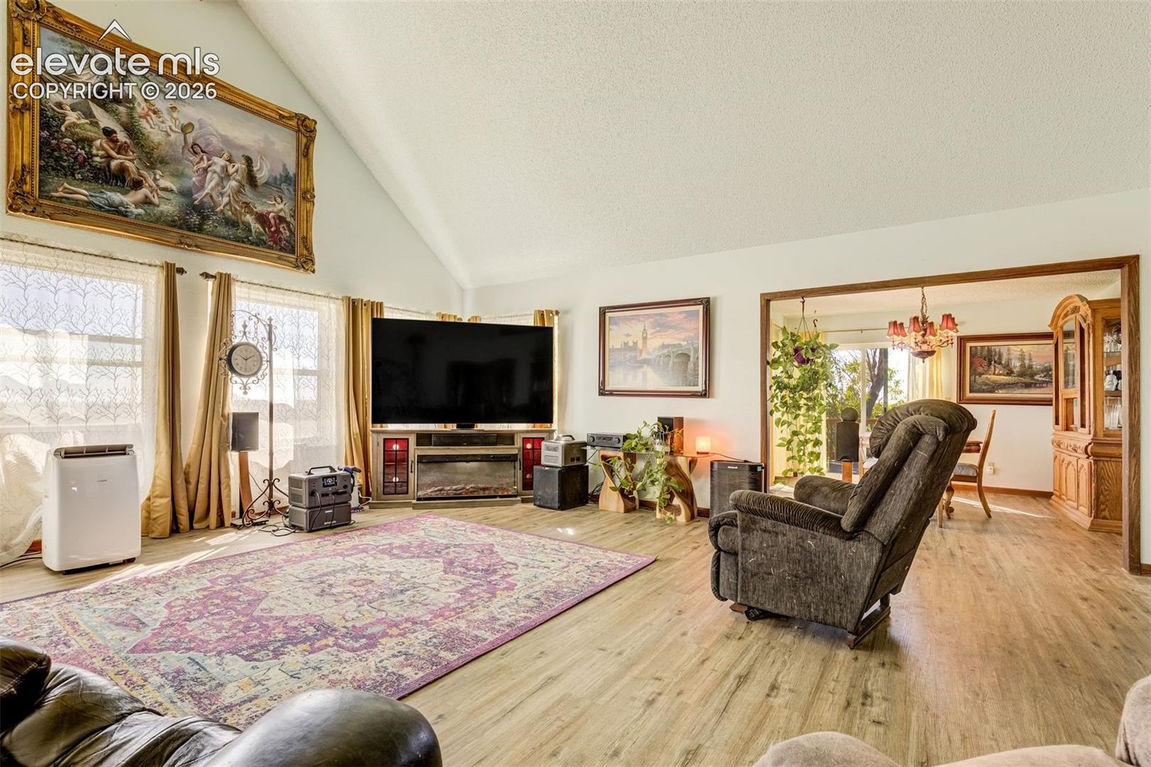 Brand new LPV flooring. Large living room with vaulted ceilings and brand new flooring.