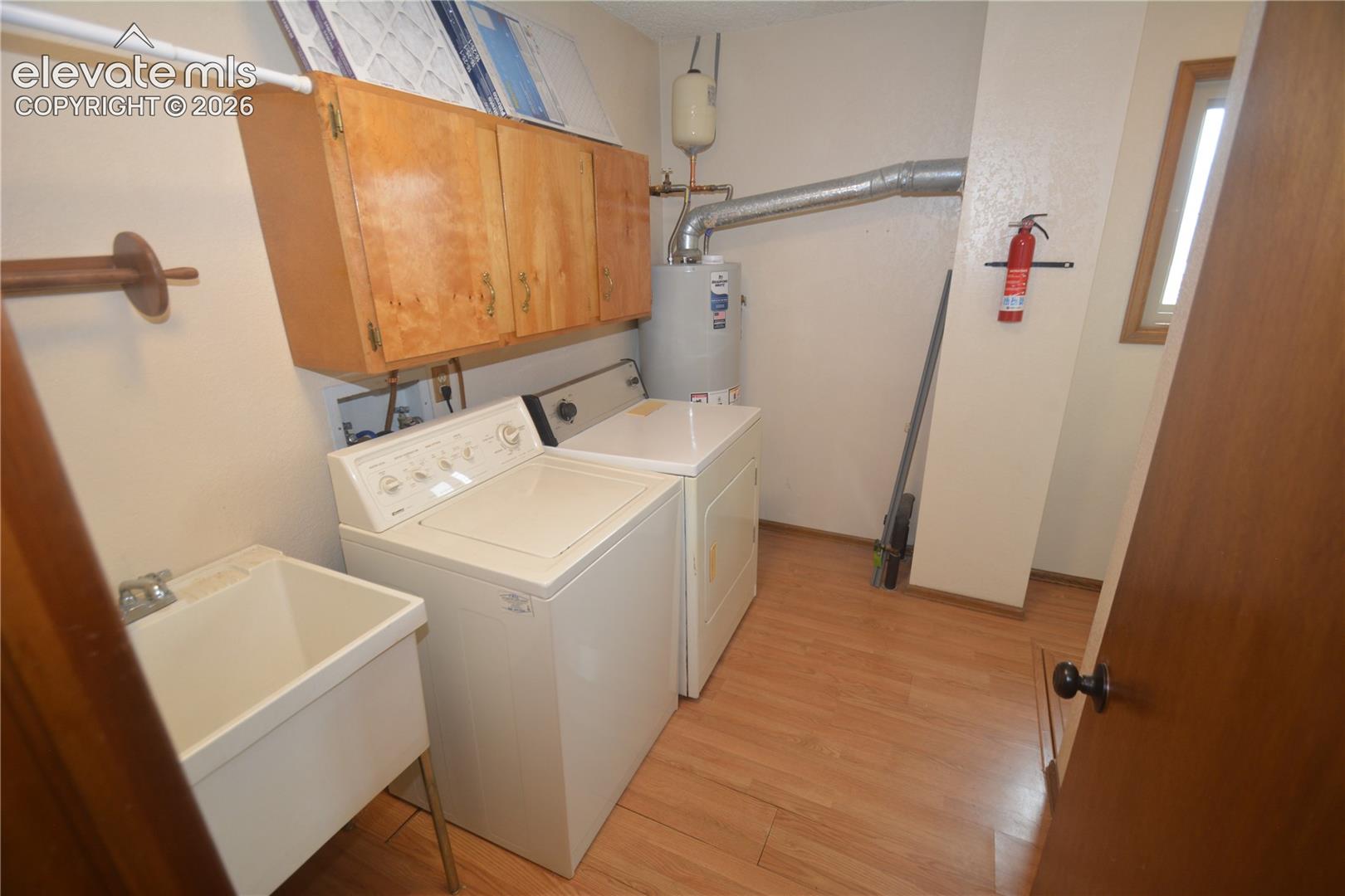 Huge main level laundry space with Sink and window
