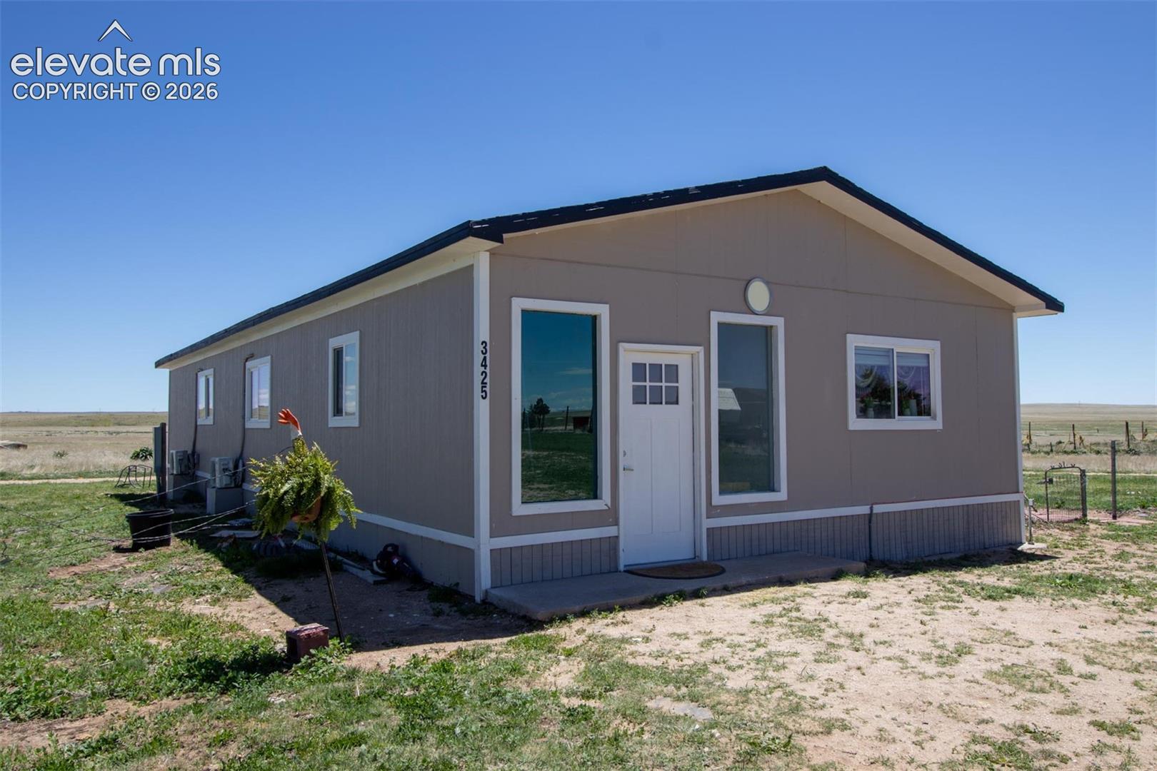 - View of front facade with cooling unit