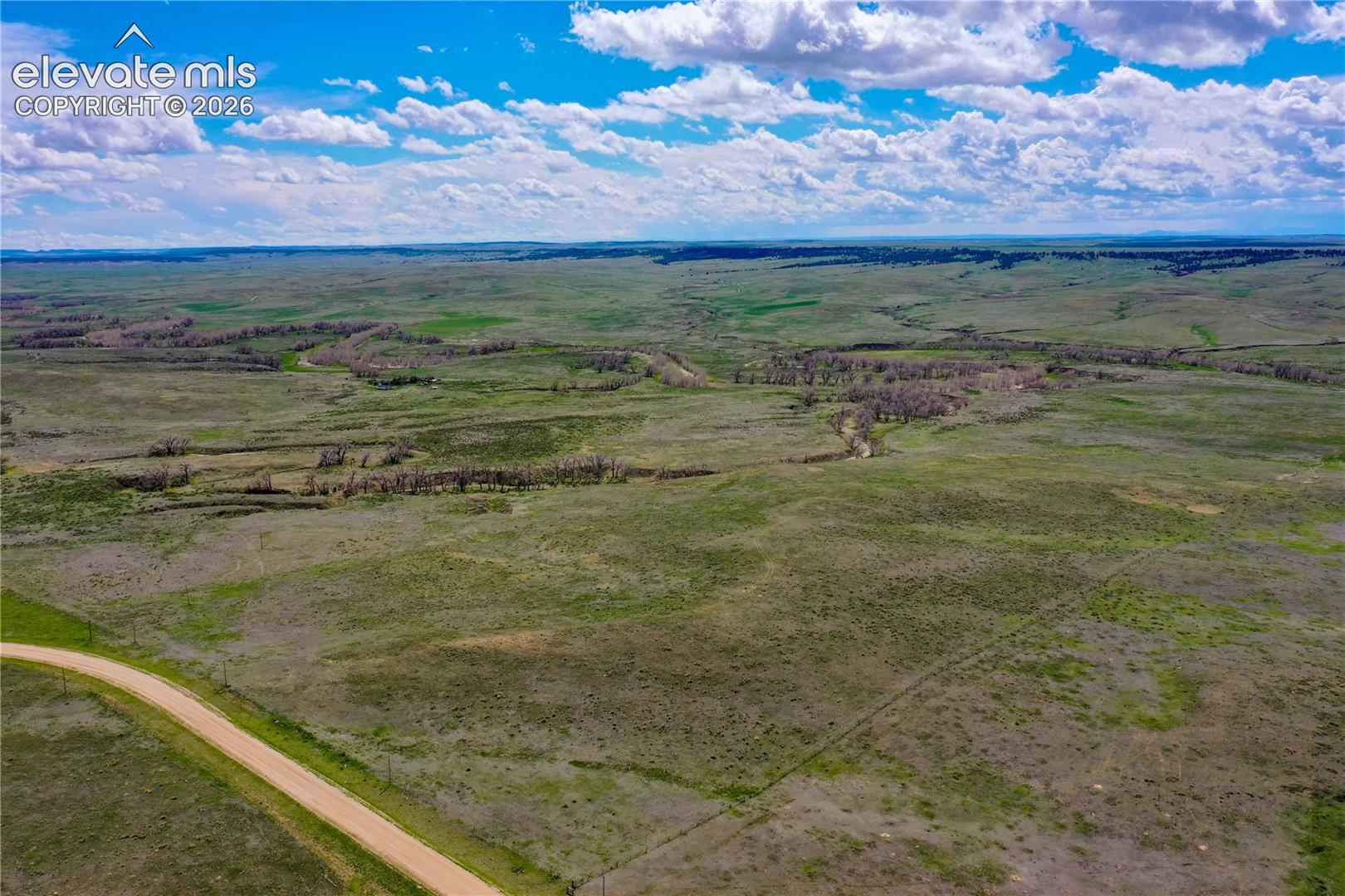 Birds eye view of property featuring a rural view