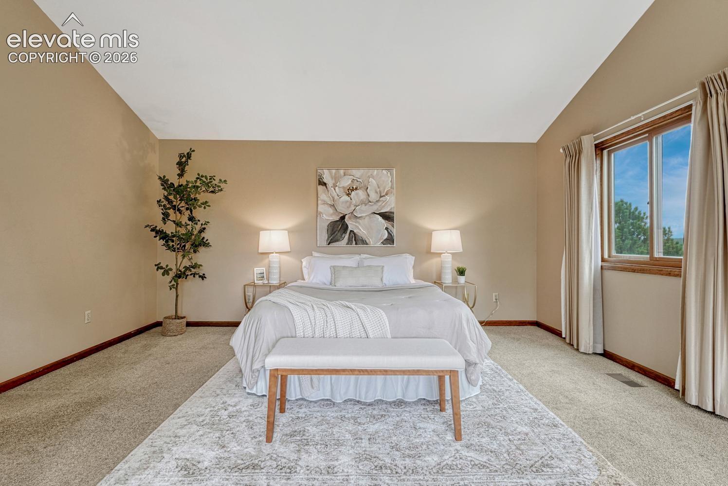 The expansive primary suite offers speaker wiring, skylights, auto shades, walk-in closet, and full bath with jetted tub/shower.
