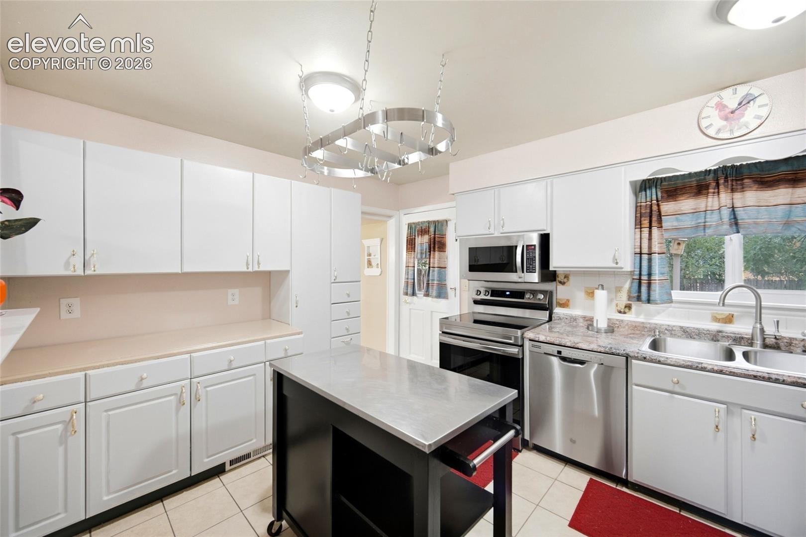 Spacious counter tops and window over the sinks looks into the backyard. 