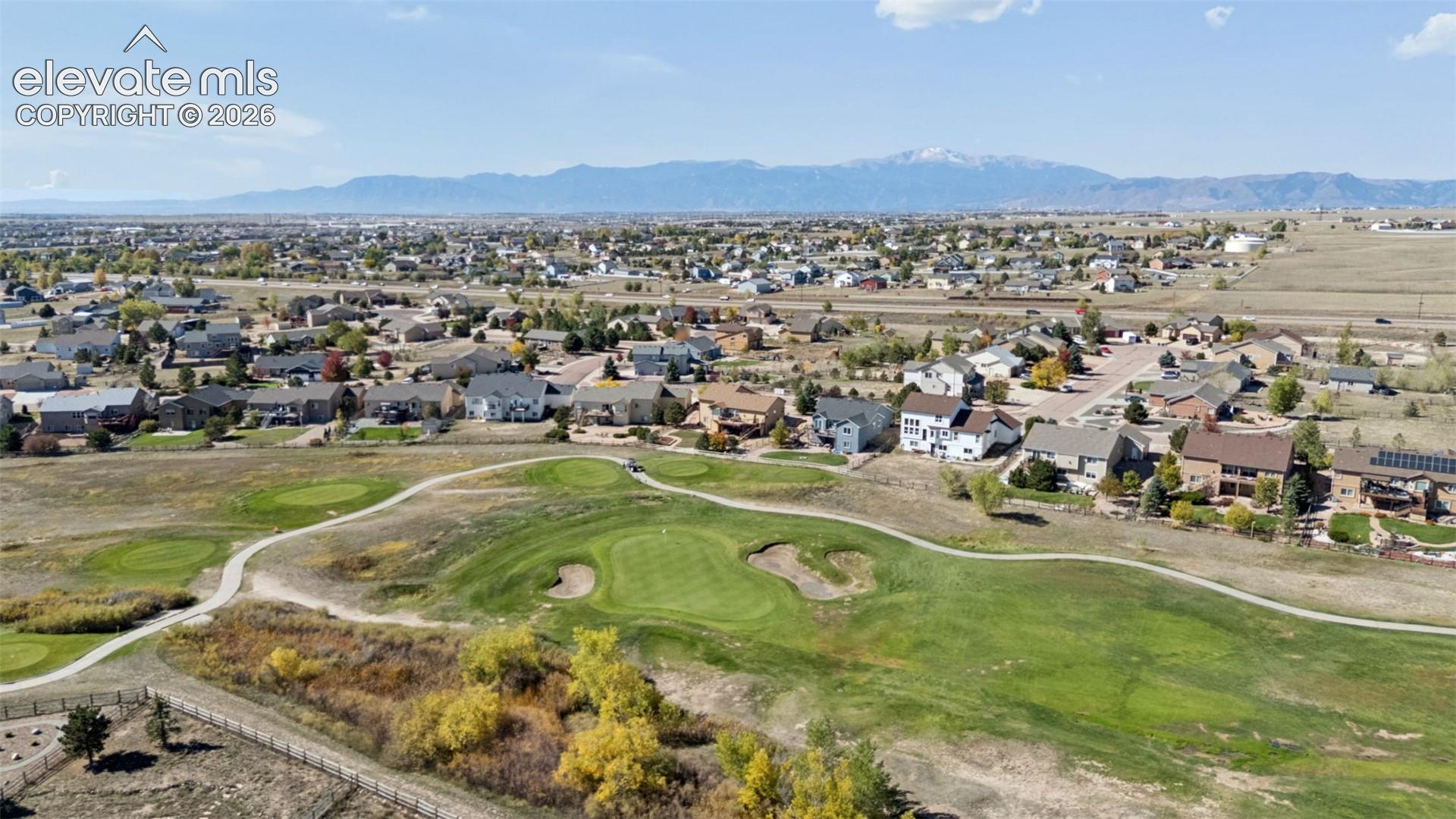 Expansive golf course frontage with mountain backdrop