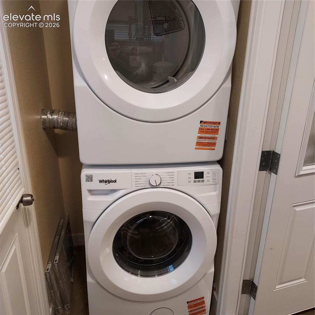 Stacked Whirlpool front-load washer and dryer unit