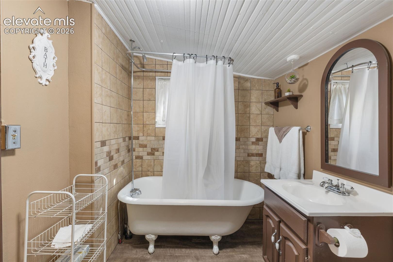 Freestanding clawfoot bathtub with a shower kit