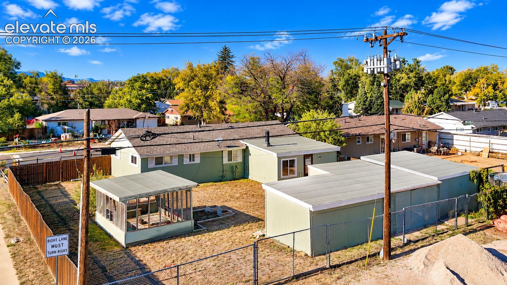 Overhead perspective highlighting the property's backyard, rear addition, and convenient proximity to Church overflow parking behind the property