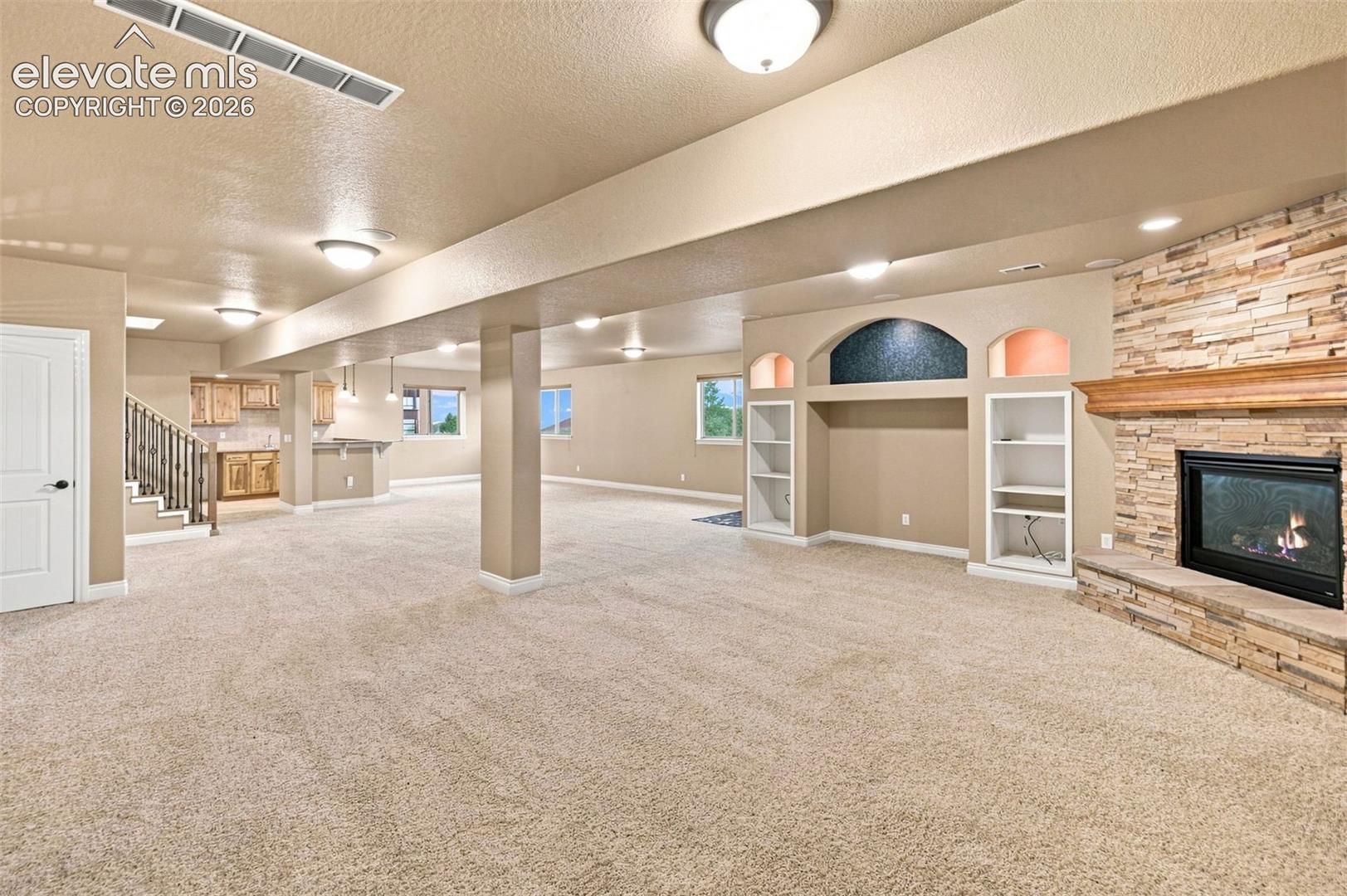 TV area - open to large great room baement w/ room for gaming and play! Walkout!!