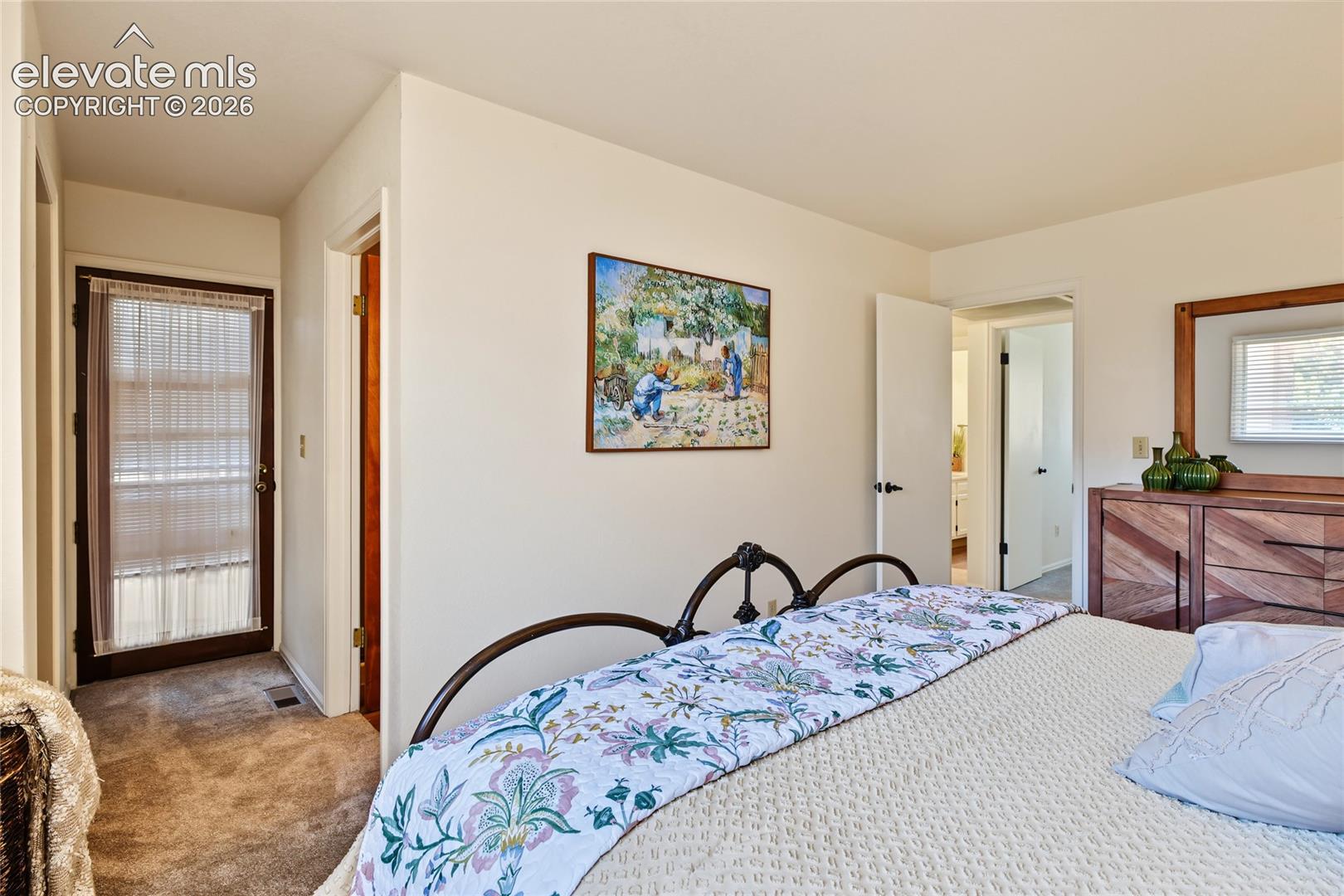 Carpeted flooring complemented by light-colored walls
